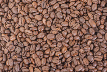 Roasted coffee beans as a background. Macro photo of coffee. Arabica.
