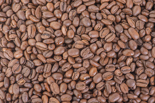 Roasted coffee beans as a background. Macro photo of coffee. Arabica.