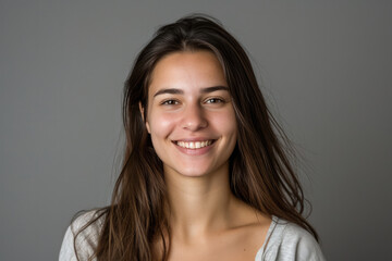 Naklejka premium A woman without makeup is smiling for the camera