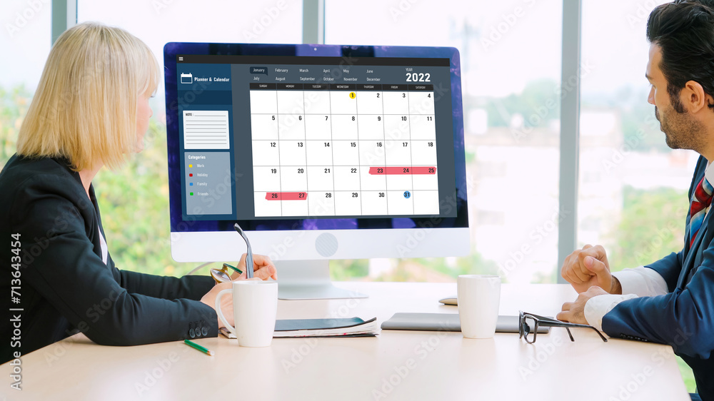 Poster calendar on computer software application for modish schedule planning for personal organizer and on