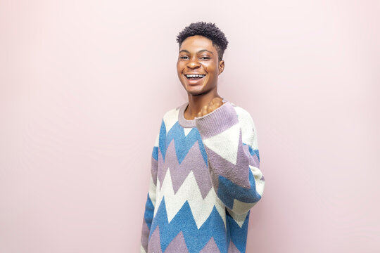 The Radiant Rose, A Vibrant Young african Embracing the Pink Wall of Limitless Inspiration