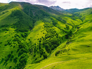 Green grassy mountains landscape Georgia - Aerial photo background