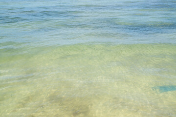 View of tropical island with white sand and turquoise crystal clear sea water.