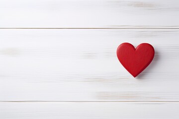 Overhead shot of a small red heart on a white wooden background - romantic concept, copy space - generative ai