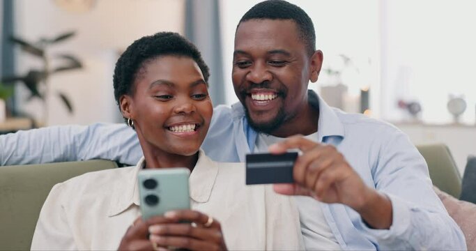 Couple, phone and credit card on sofa, home living room and happy for discount, sale or savings with fintech. African man, black woman and smartphone for digital banking, deal or e commerce on couch