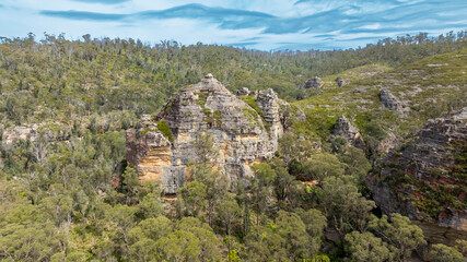 Drone aerial photograph of the impressive sandstone rock formations in the Gardens of Stone State Conservation area near Lithgow in New South Wales in Australia