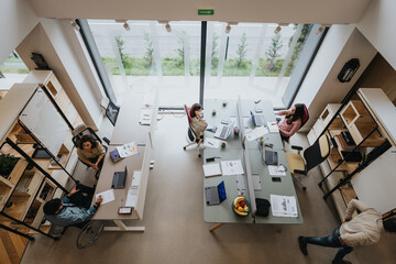 Modern office environment with diverse team engaged in creative work.