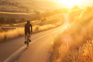 Schilderijen op glas Cyclist Enjoying a Scenic Sunset Ride Along a Country Road © SMPTY