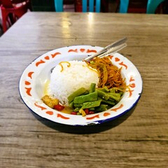 Traditional food from Indonesia consists of rice, with noodles and vegetables