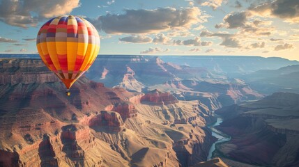 Obraz premium Hot Air Balloon Soaring Over Majestic Canyon