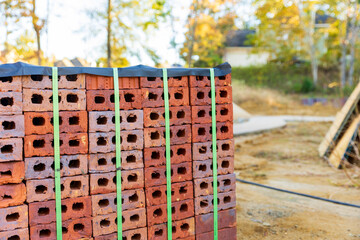 Stack of bricks for home construction with copy space