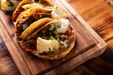 Tacos al pastor. Also known as Tacos de Trompo, they are the most popular type of street tacos in Mexico, commonly made with pork and beef marinated with achiote.