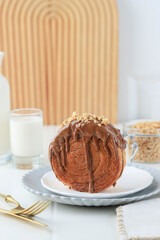 Cromboloni or Crombolini, Croissant Bomboloni Round New York Roll with Chocolate Sauce