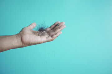 man hold his list hair close up 