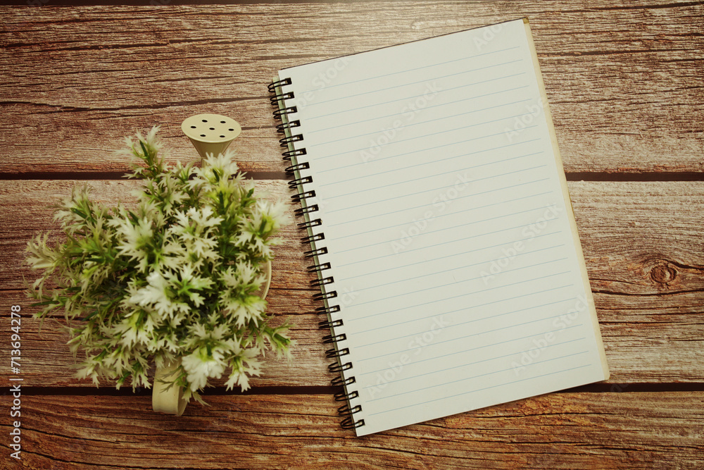 Poster empty notebook open on wooden background