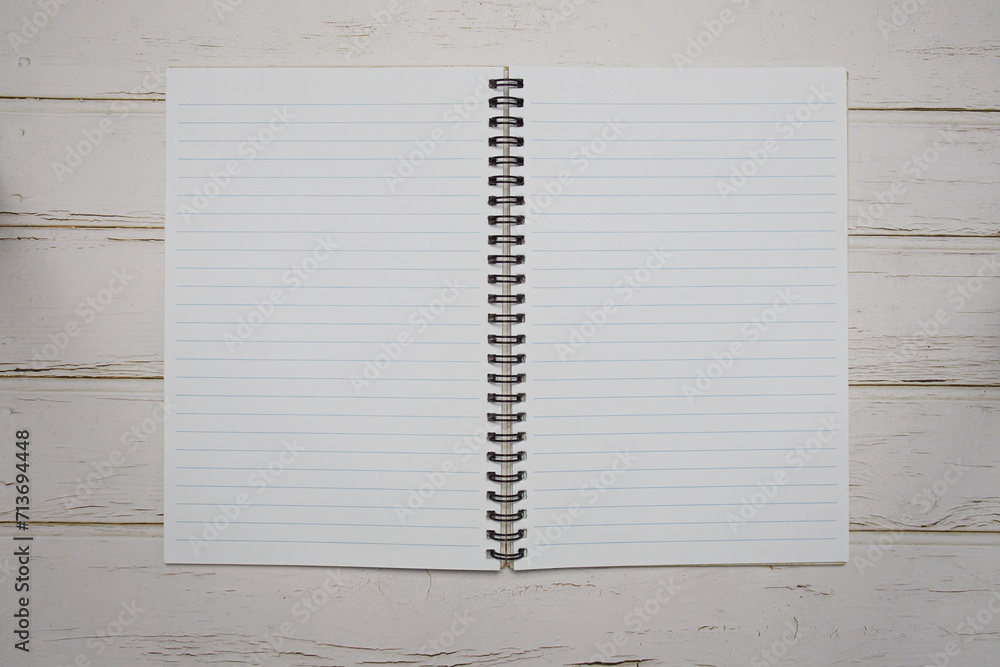 Poster empty notebook open on wooden background