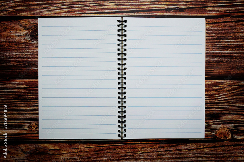 Poster empty notebook open on wooden background