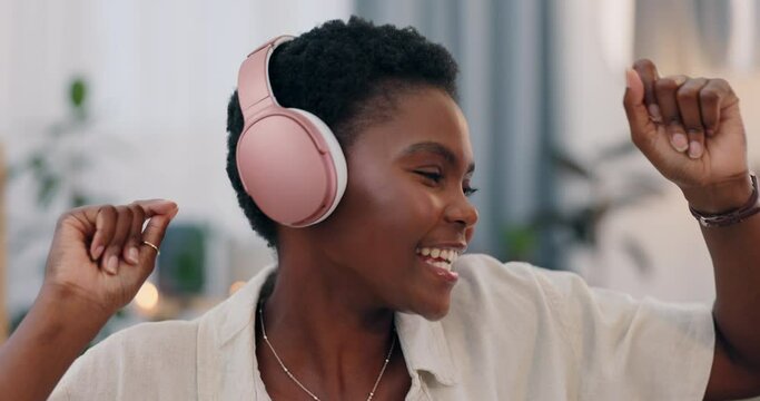African woman, headphones and music in home, dancing and happy for streaming subscription in lounge. Girl, person and excited for audio tech, sound and dancer with smile in living room at house