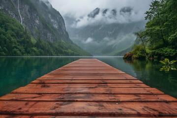 Wooden pier with natural lake and high mountain at background.