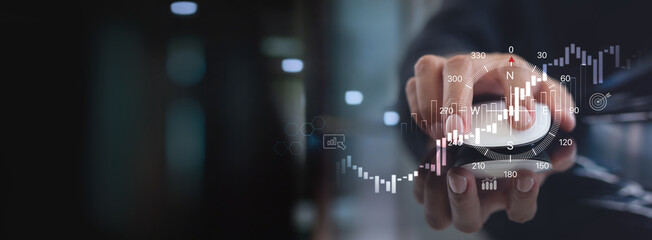 Business growth, purpose and direction for business development. Businessman with compass navigator and market research, strategy and planning for business solution, finance and investment background © tippapatt