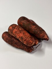 a carrot with dirt on it