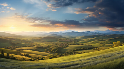 Naklejka na ściany i meble Panorama of beautiful countryside. Broad of the countryside with green field in foregroundsunny afternoon. Wonderful springtime landscape in mountains. Grassy field and rolling hills. rural scenery
