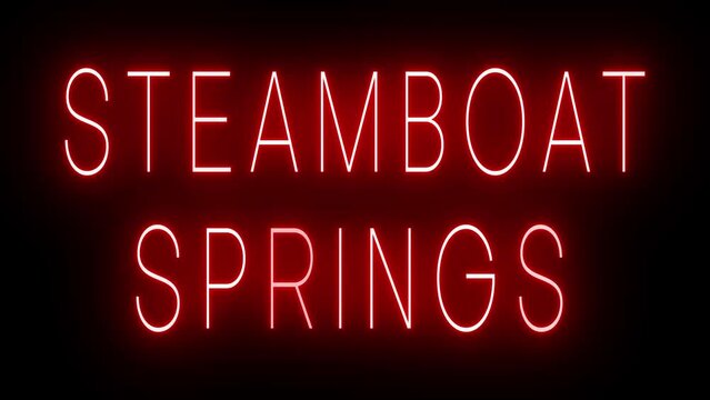 Flickering red retro style neon sign glowing against a black background for STEAMBOAT SPRINGS