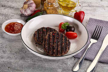 Grilled burger cutlet with sauce
