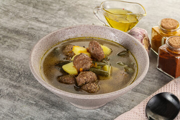 Soup with meatball and potato