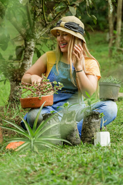 Latin woman planting in the garden in spring