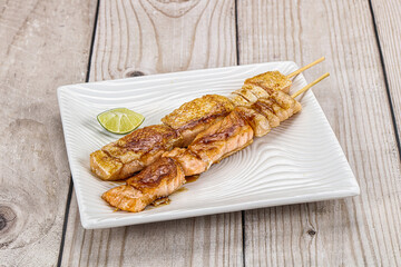 Grilled salmon skewer with sauce
