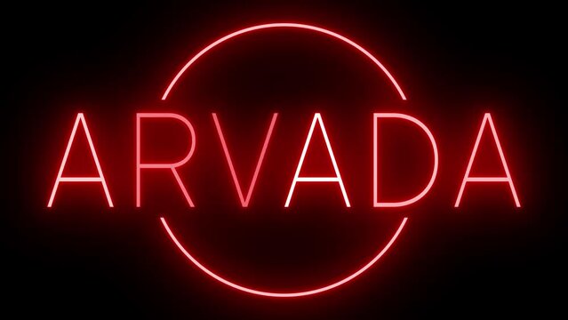 Flickering red retro style neon sign glowing against a black background for ARVADA