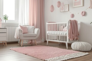 Simple, pink baby bedroom with cot and rug.