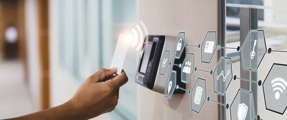 Fotobehang Proximity card door unlock, Hand security man using fingerprint scan on ID card reader access control system for identity verification to open the door or for security safety or check attendance. © Eakrin