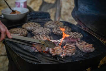 Isolated close up of a typical Israeli bar-b-q with some burgers and steaks- Israel
