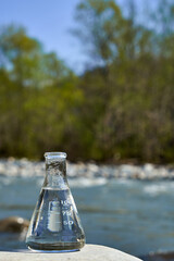 Glass flask with clean drinking water.