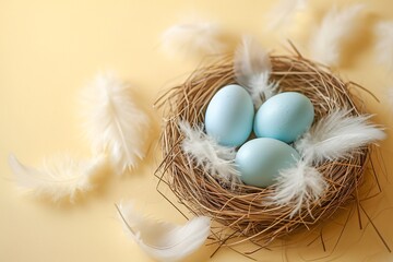 Blue Easter eggs in a nest with white feathers on a yellow background. Easter and springtime concept. Design for poster, invitation, banner. Minimalistic composition. Top view