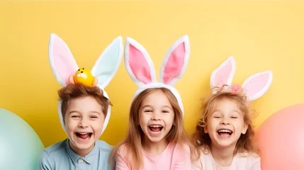 Fotobehang Happy children in bunny ears celebrating easter © May Thawtar