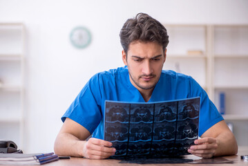 Young male doctor radiologist working in the clinic