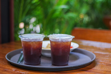 black iced coffee on the table