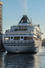 Early morning sunrise arrival of classic German cruiseship cruise ship liner into Montr&eacute;al port, Quebec in Canada during St Lawrence Indian Summer cruising