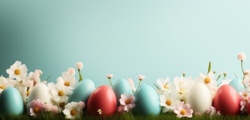 Obraz premium easter eggs in the grass with light color background, copy space text