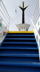 The stairs of a ferry in Italy towards the Mediterranean islands.