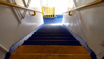 The stairs of a ferry in Italy towards the Mediterranean islands.