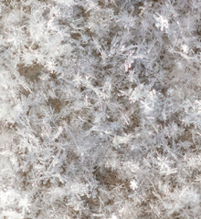White snowflakes in winter as an abstract background. Texture