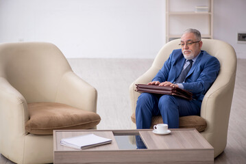 Old businessman waiting for business meeting