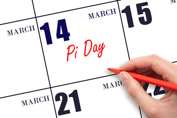 March 14. Hand writing text Pi Day on calendar date. Save the date.