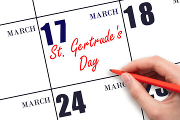 March 17. Hand writing text St. Gertrude's Day on calendar date. Save the date.