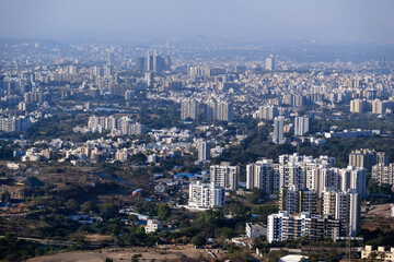 Fototapeta na wymiar 19 January 2024, Cityscape Skyline, Cityscape of Pune city view from Bopdev Ghat, Pune, Maharashtra, India.