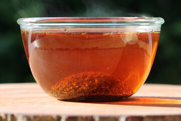 cinnamon tea splash inside hot water